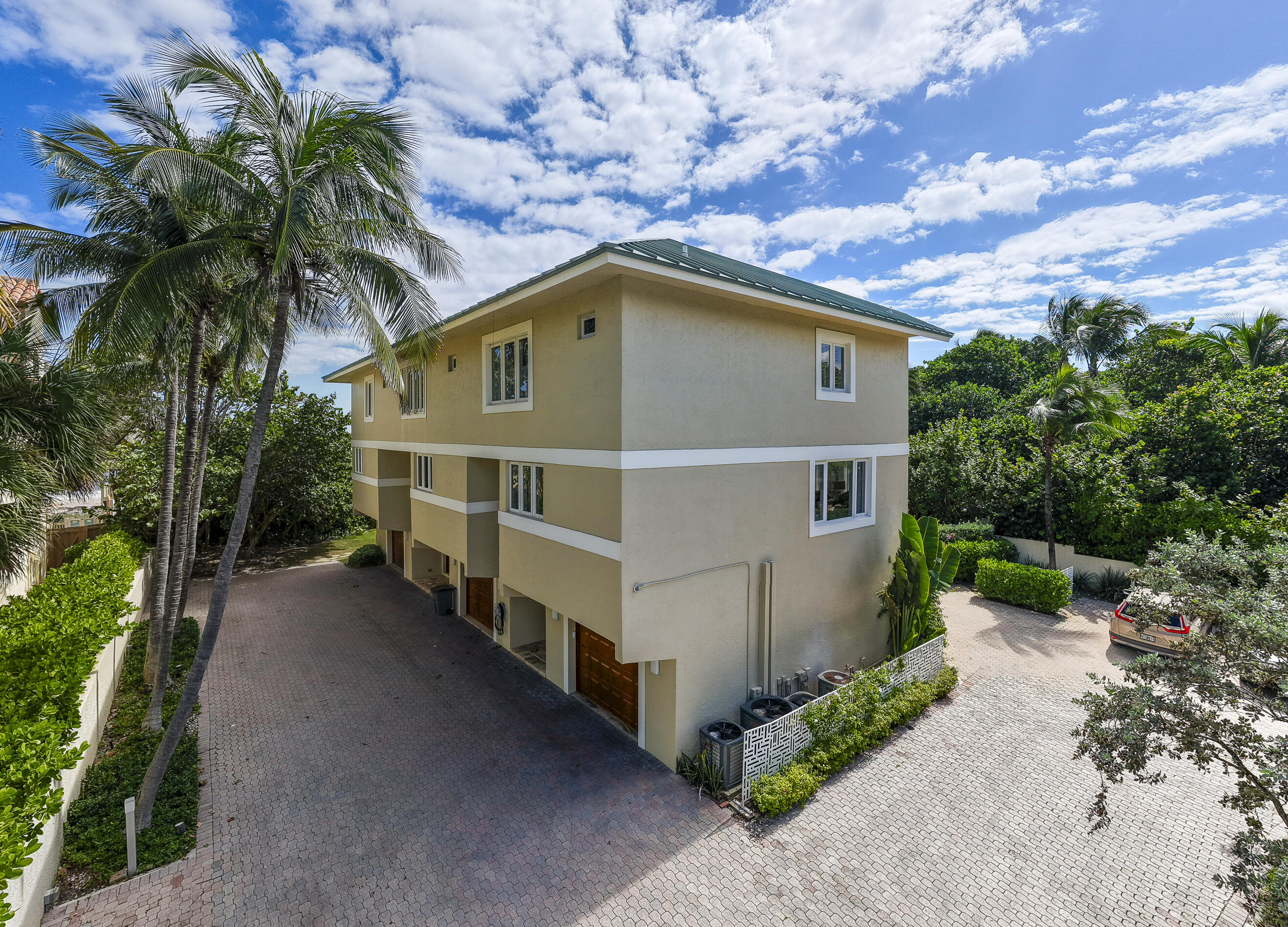 4535 Coquina Road Ocean Ridge, FL 33435 - Photo 36 of 45 a house with trees in the background