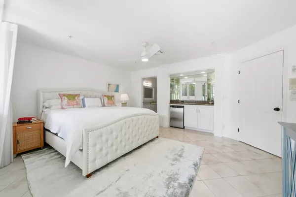 a bedroom with a bed and a cabinets