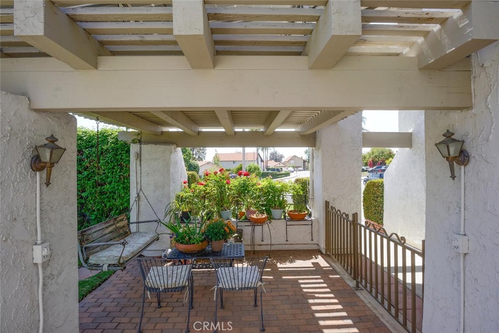 10424 Cartilla Court Rancho Cucamonga, CA 91737 - Photo 22 of 36 a view of a porch with chairs and potted plants
