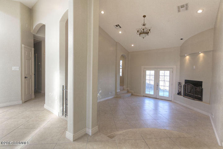 430 Churea Lane Rio Rico, AZ 85648 - Photo 9 of 14 a view of an empty room with a fireplace and a window