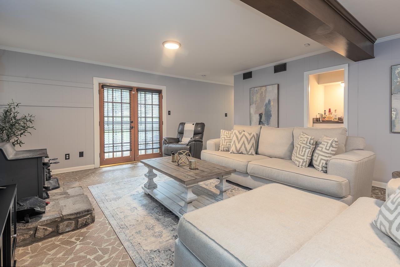 5681 Normandy Road Memphis, TN 38120 - Photo 16 of 22 a living room with furniture and a large window