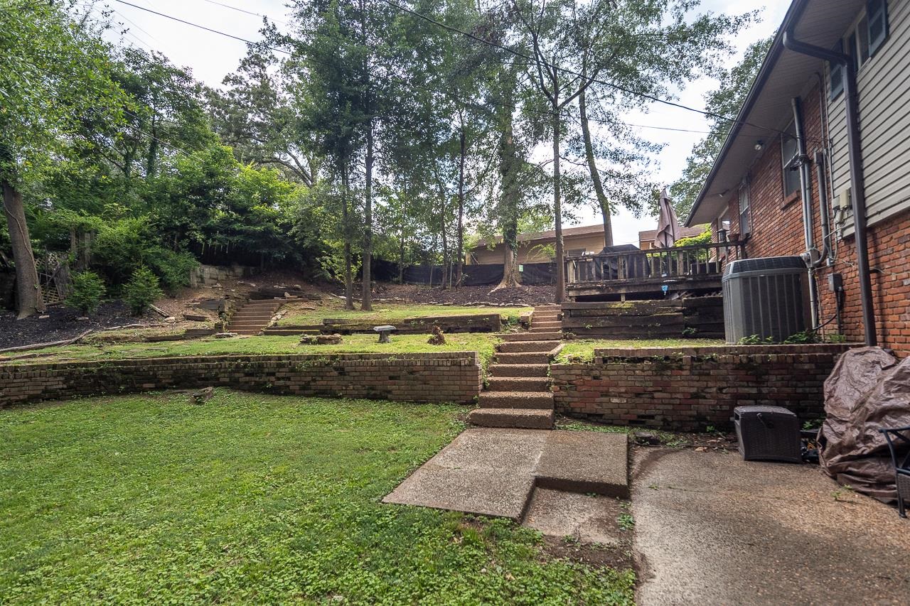 5681 Normandy Road Memphis, TN 38120 - Photo 20 of 22 a view of a garden with wooden bench