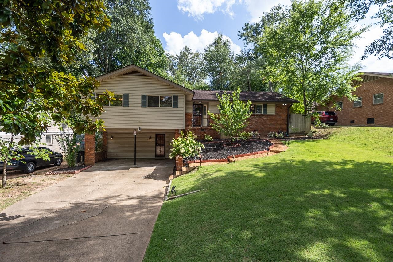 5681 Normandy Road Memphis, TN 38120 - Photo 2 of 22 a front view of a house with yard and tree