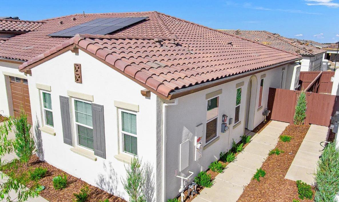 Check out the Side Front Entry!! Lovely Tile Roof...