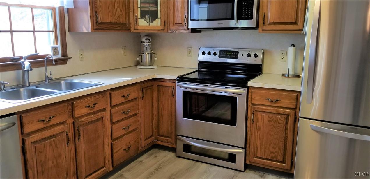 159 Meyer Road Nazareth, PA 18064 - Photo 15 of 19 a kitchen with stainless steel appliances granite countertop a stove and a refrigerator