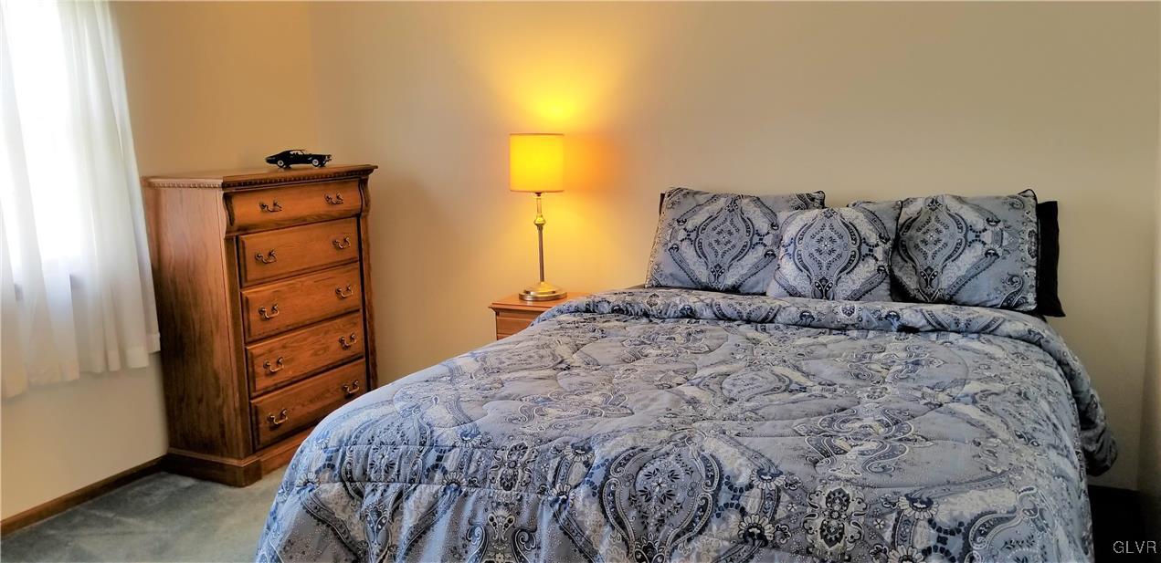 159 Meyer Road Nazareth, PA 18064 - Photo 17 of 19 a bed sitting in a bedroom next to a window with dresser