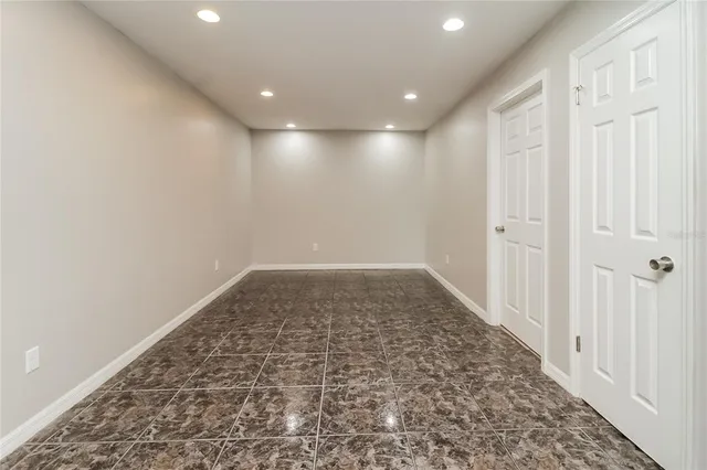 an empty room with wooden floor