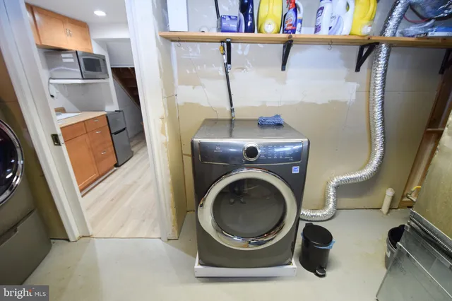 a bathroom with a window and a shower