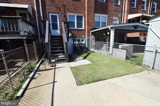 a view of a house with wooden deck