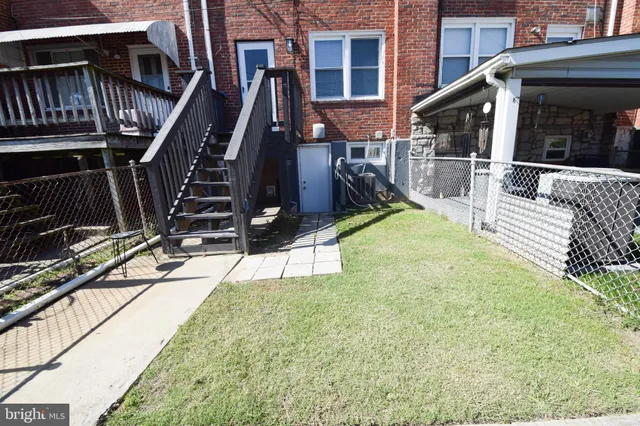 a front view of a house with parking space
