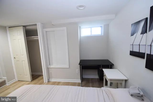 a view of bedroom and hallway