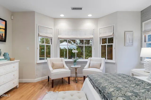 a bathroom with a sink a large mirror and a shower