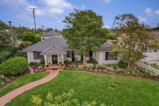a view of a house with a garden