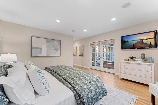 a view of a house with backyard sitting area and garden