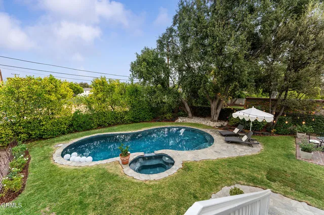 a view of a swimming pool with a patio