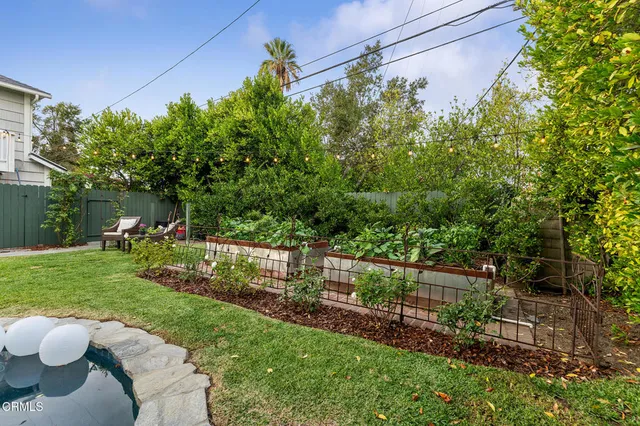 a front view of house with outdoor space and swimming pool