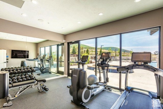 883 Wasatch View Drive, Unit 11 Kamas, UT 84036 - Photo 9 of 14 Exercise room with a mountain view, healthy amount of natural light, and recessed lighting