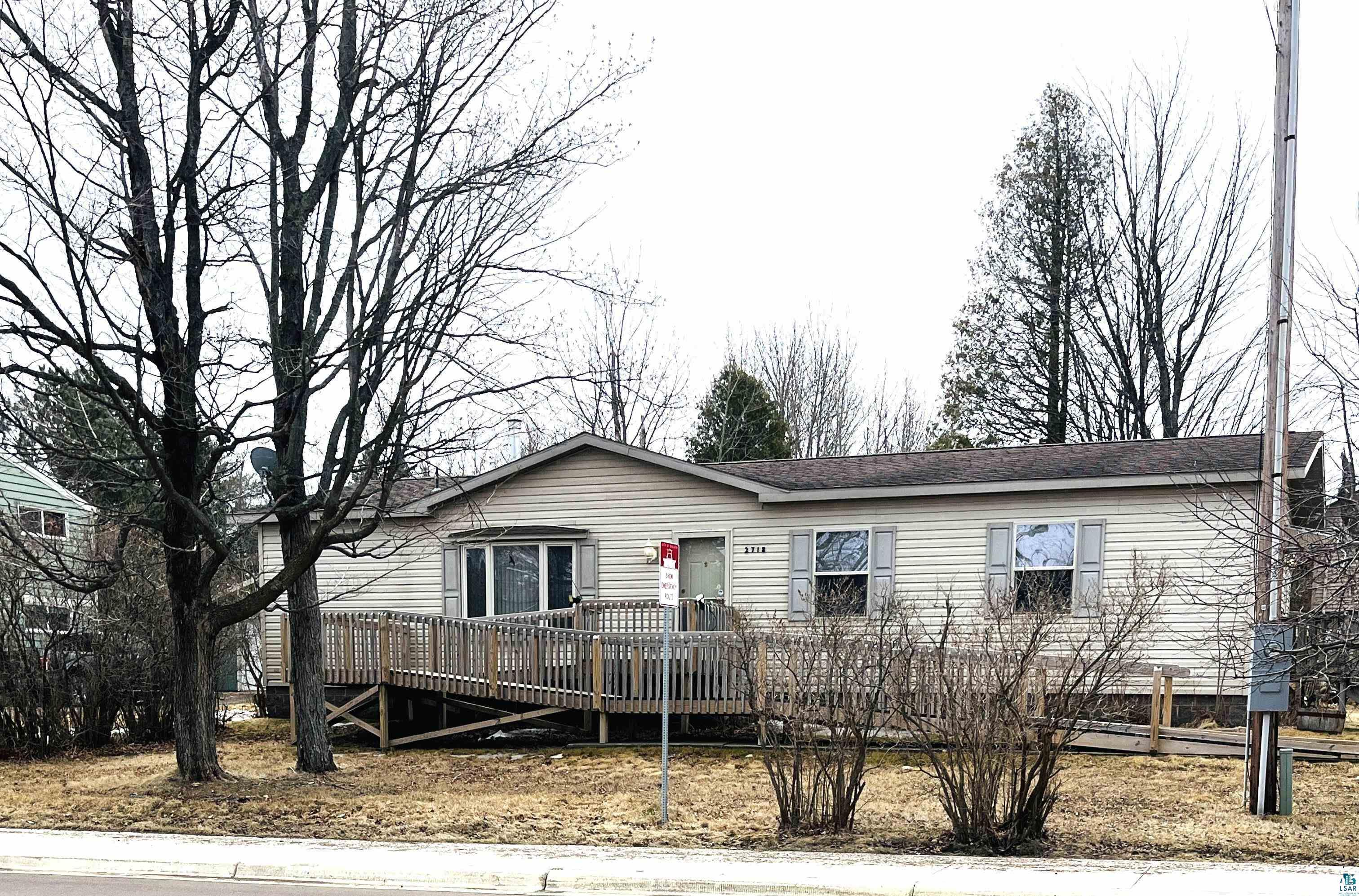 2718 Morris Thomas Road Duluth, MN 55811 - Photo 1 of 27 Manufactured / mobile home with a deck and a shingled roof