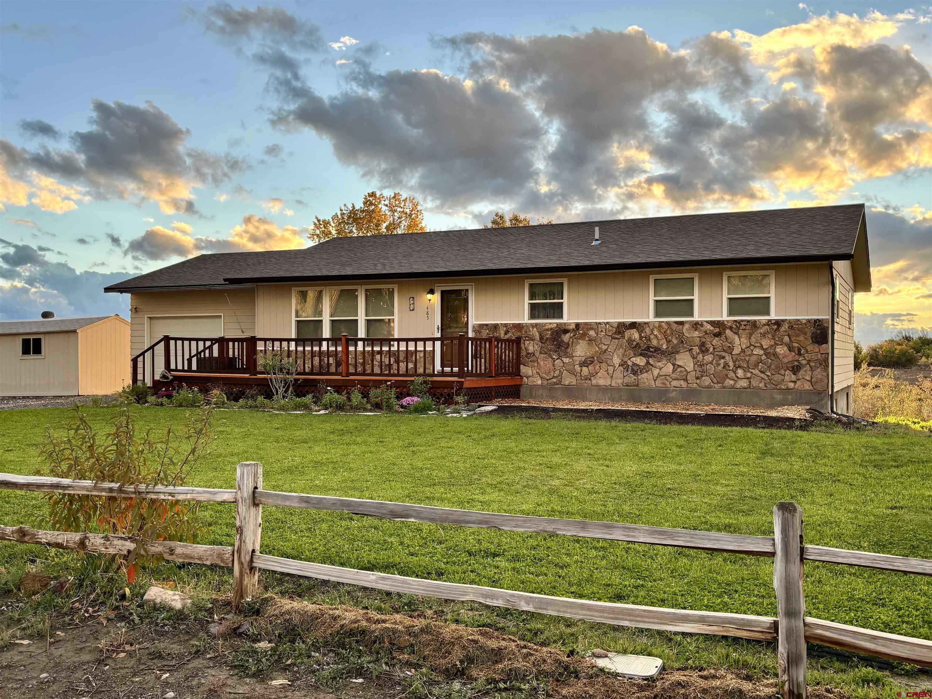 485 1740th Road Delta, CO 81416 - Photo 1 of 37 a view of a house with a yard from a large tree