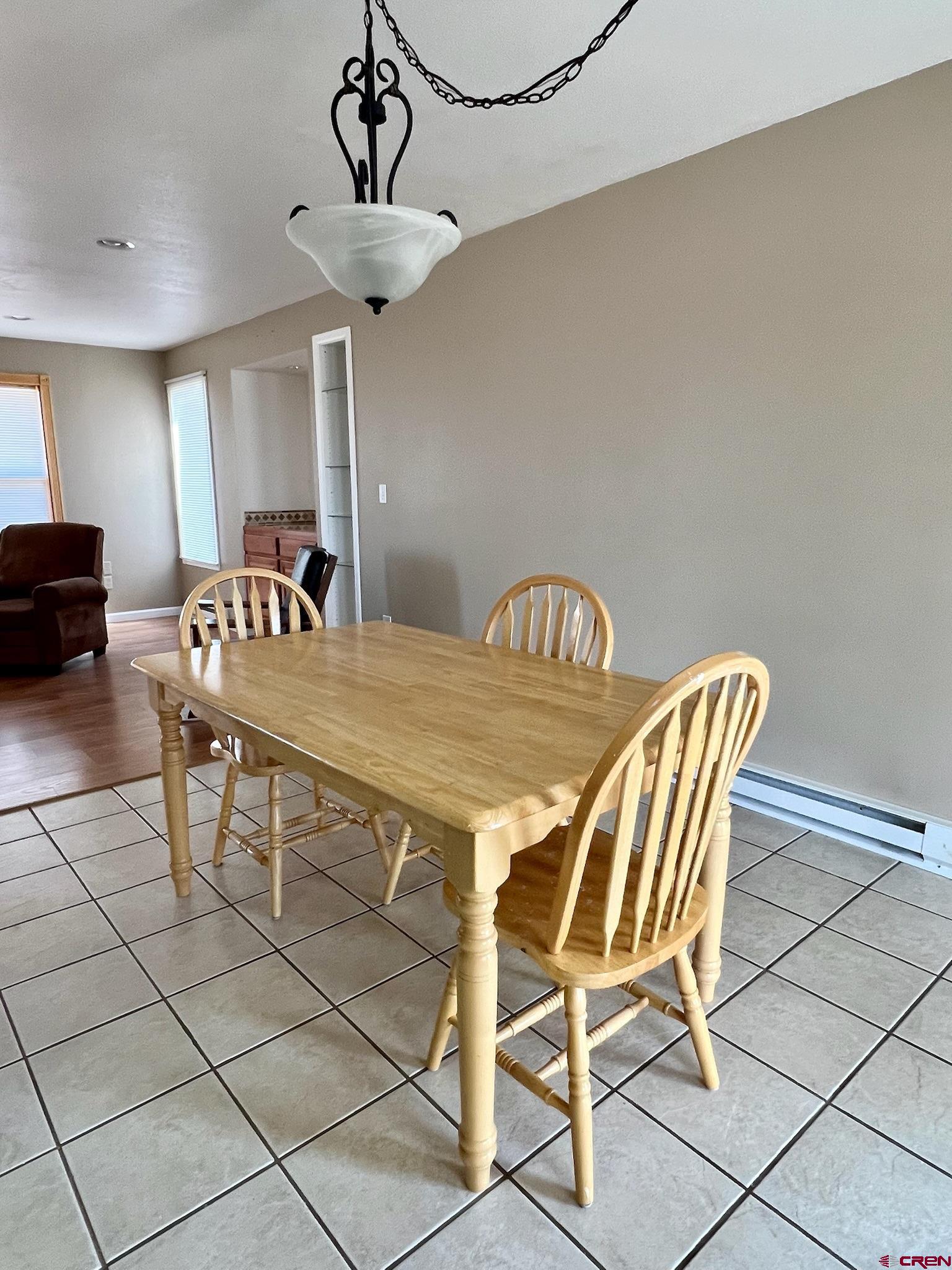 485 1740th Road Delta, CO 81416 - Photo 16 of 37 a view of a dining room with furniture and chandelier