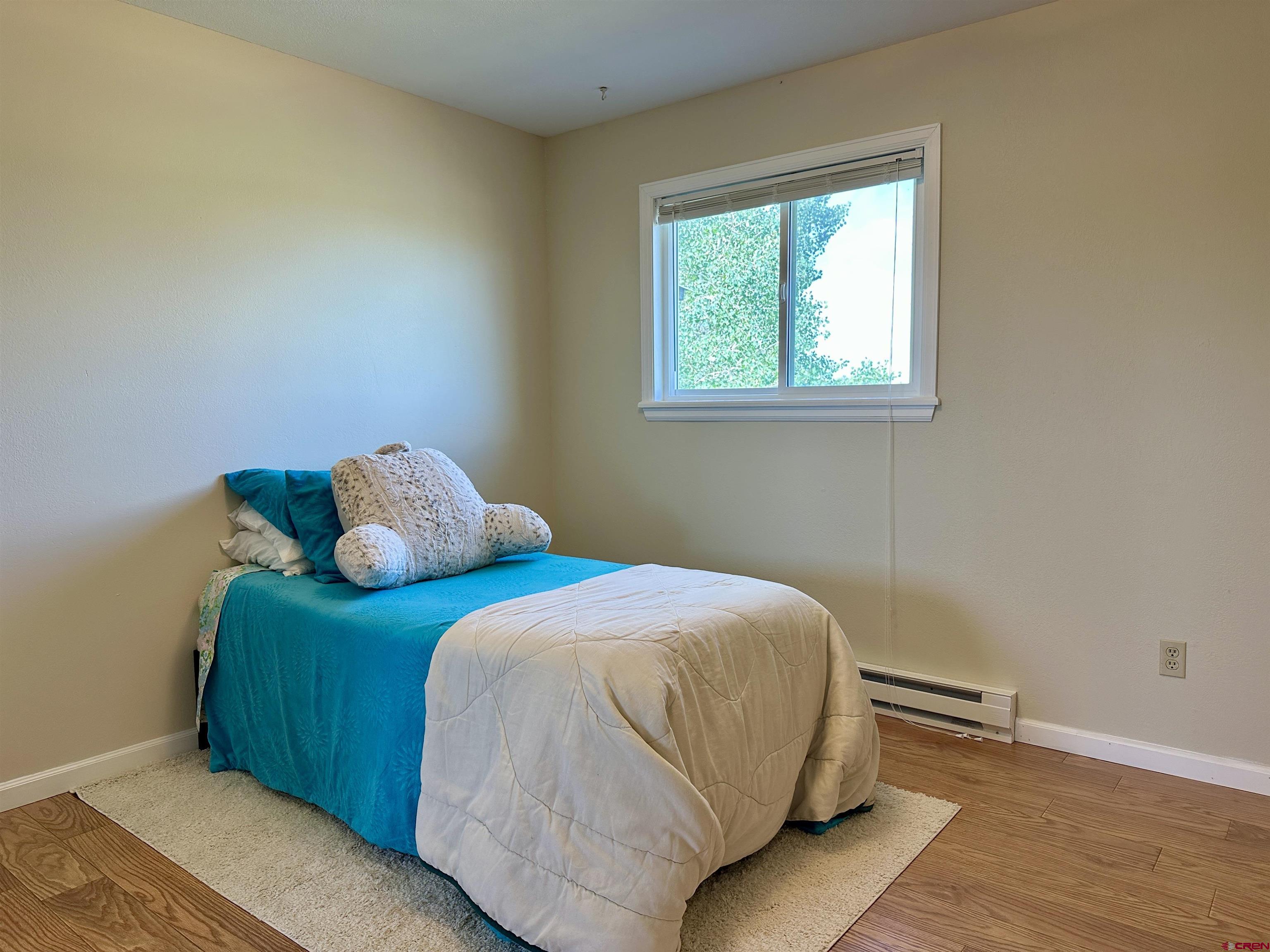485 1740th Road Delta, CO 81416 - Photo 22 of 37 a bedroom with a bed and window