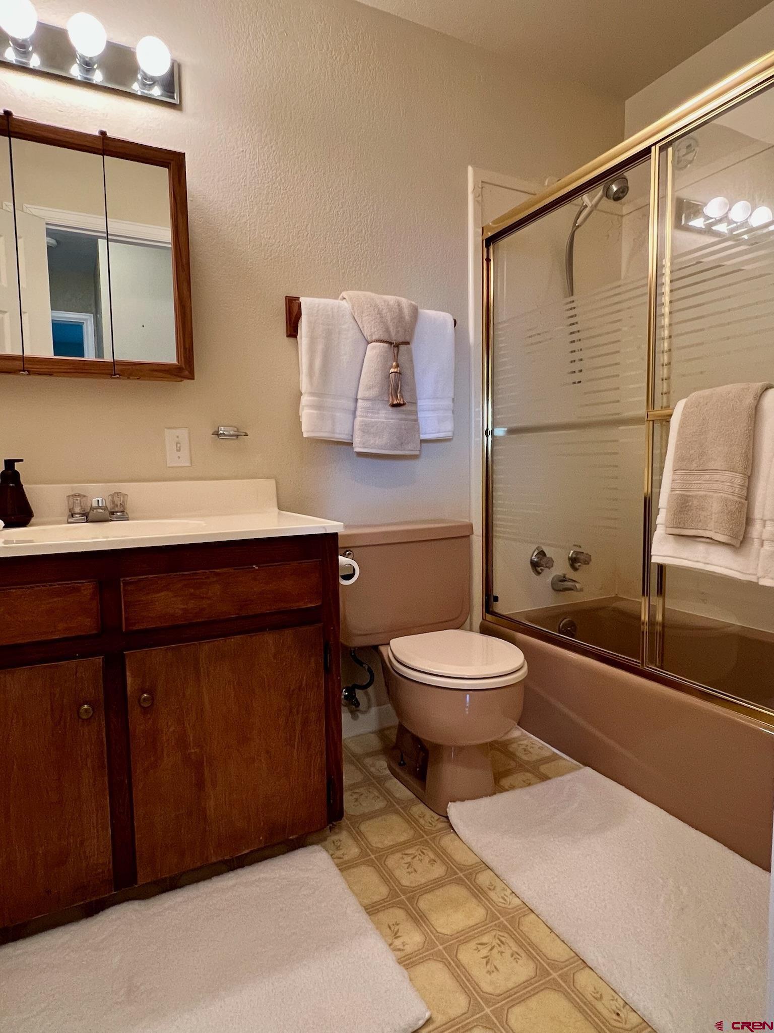 485 1740th Road Delta, CO 81416 - Photo 24 of 37 a bathroom with a toilet sink and mirror