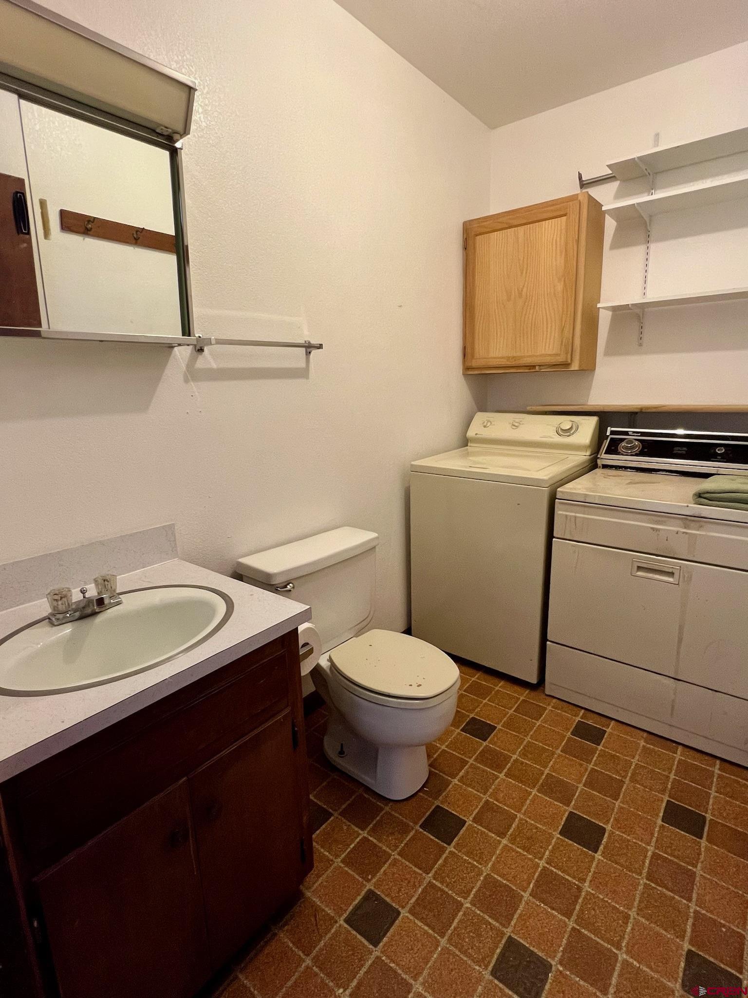485 1740th Road Delta, CO 81416 - Photo 26 of 37 a bathroom with a sink toilet and window