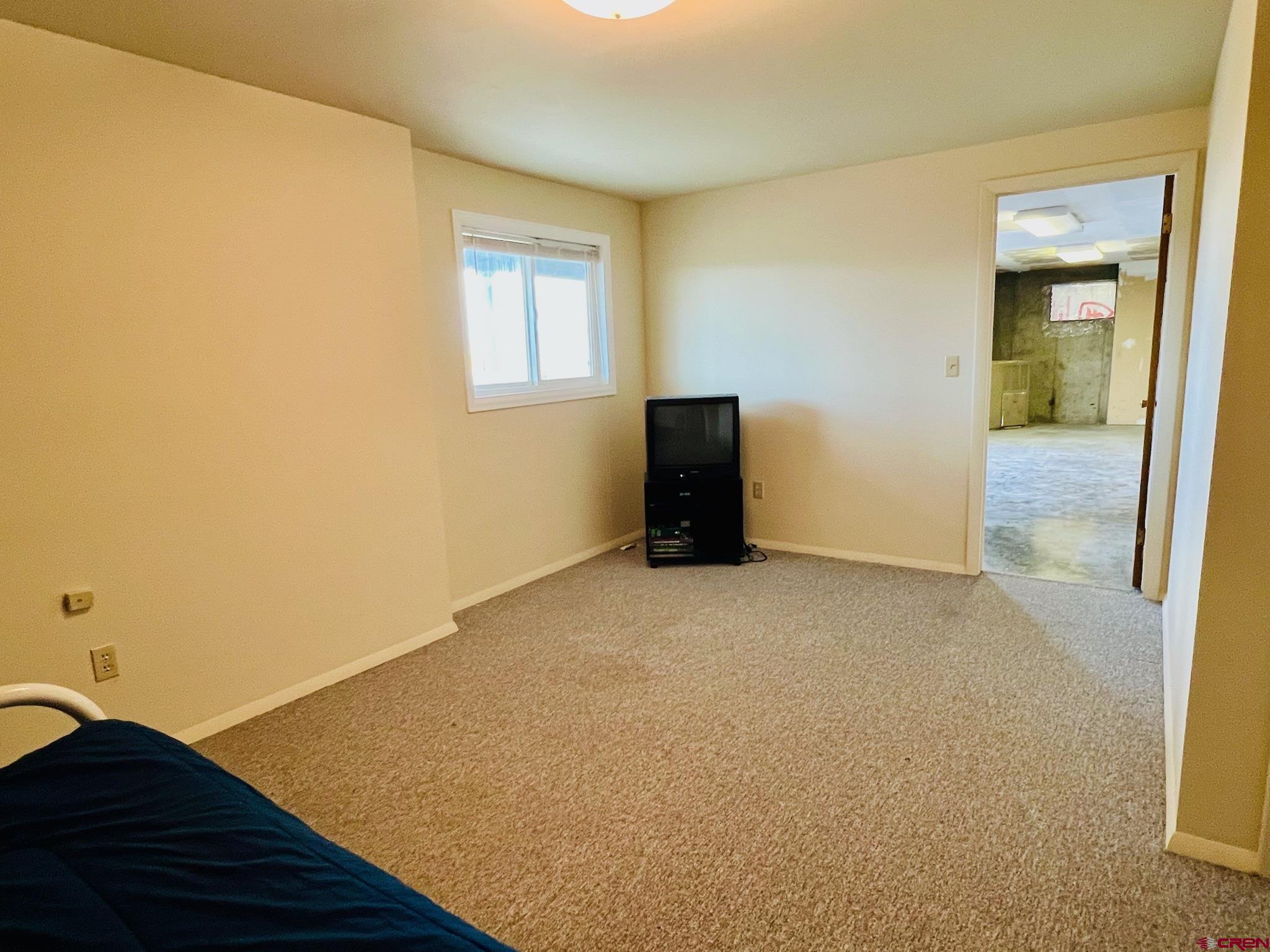 485 1740th Road Delta, CO 81416 - Photo 28 of 37 a view of empty room with wooden floor and fan