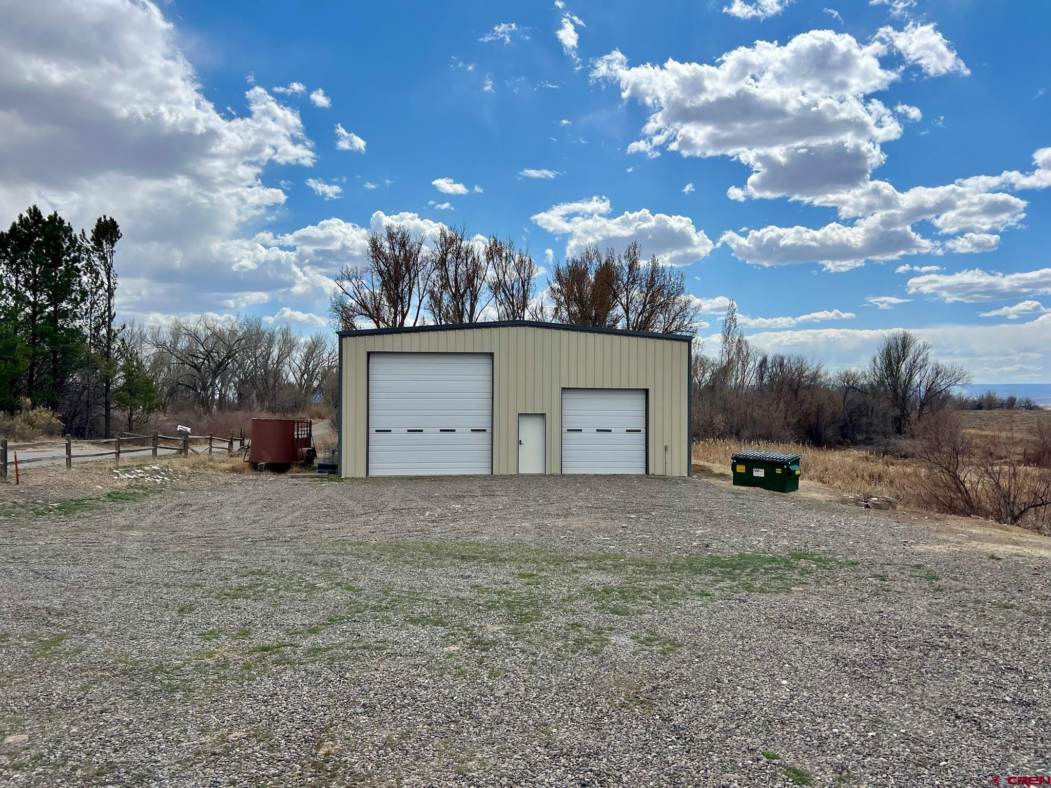 485 1740th Road Delta, CO 81416 - Photo 32 of 37 a view of a house with a yard and garage