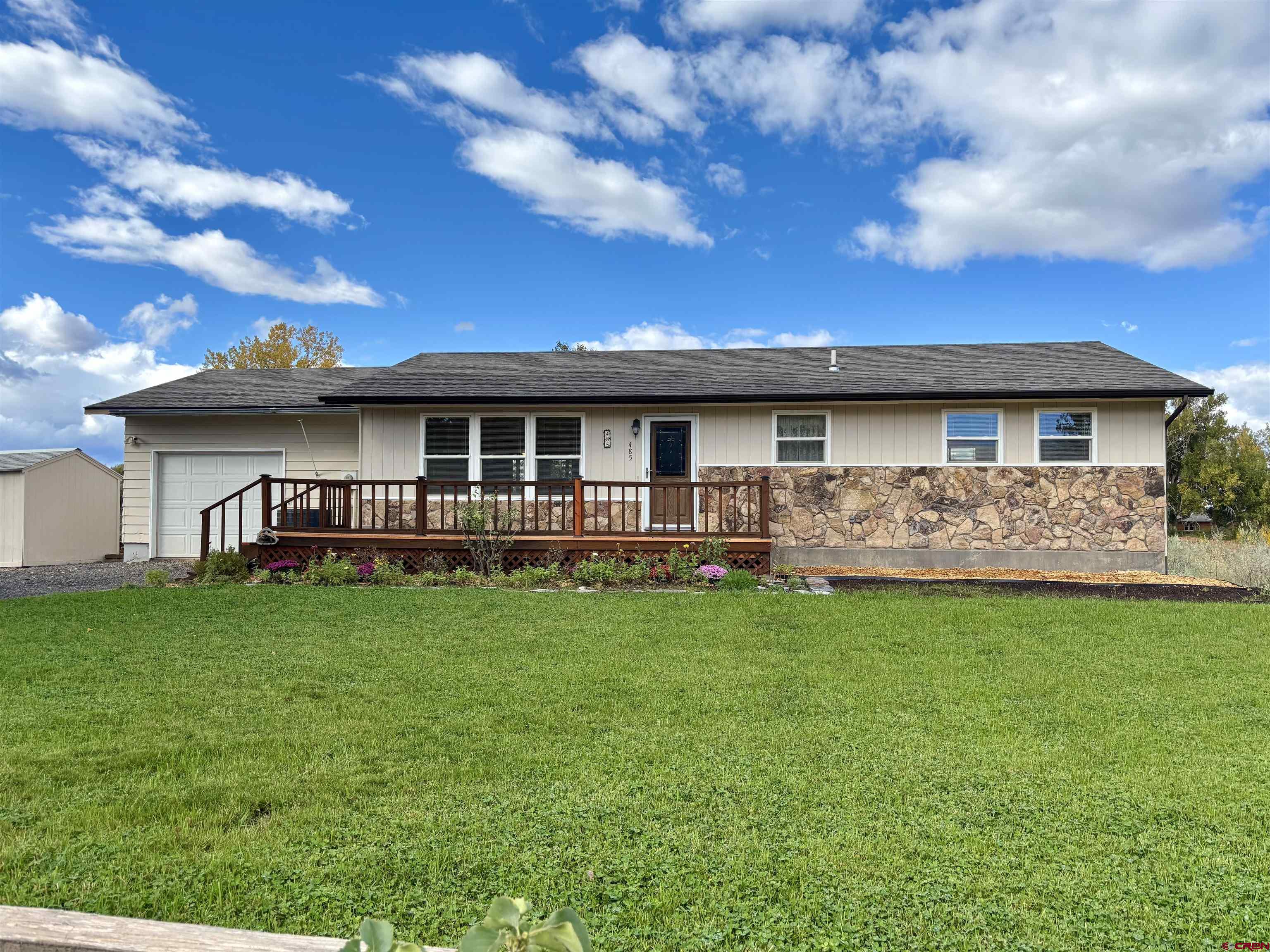 485 1740th Road Delta, CO 81416 - Photo 33 of 37 a view of an house with backyard space and balcony