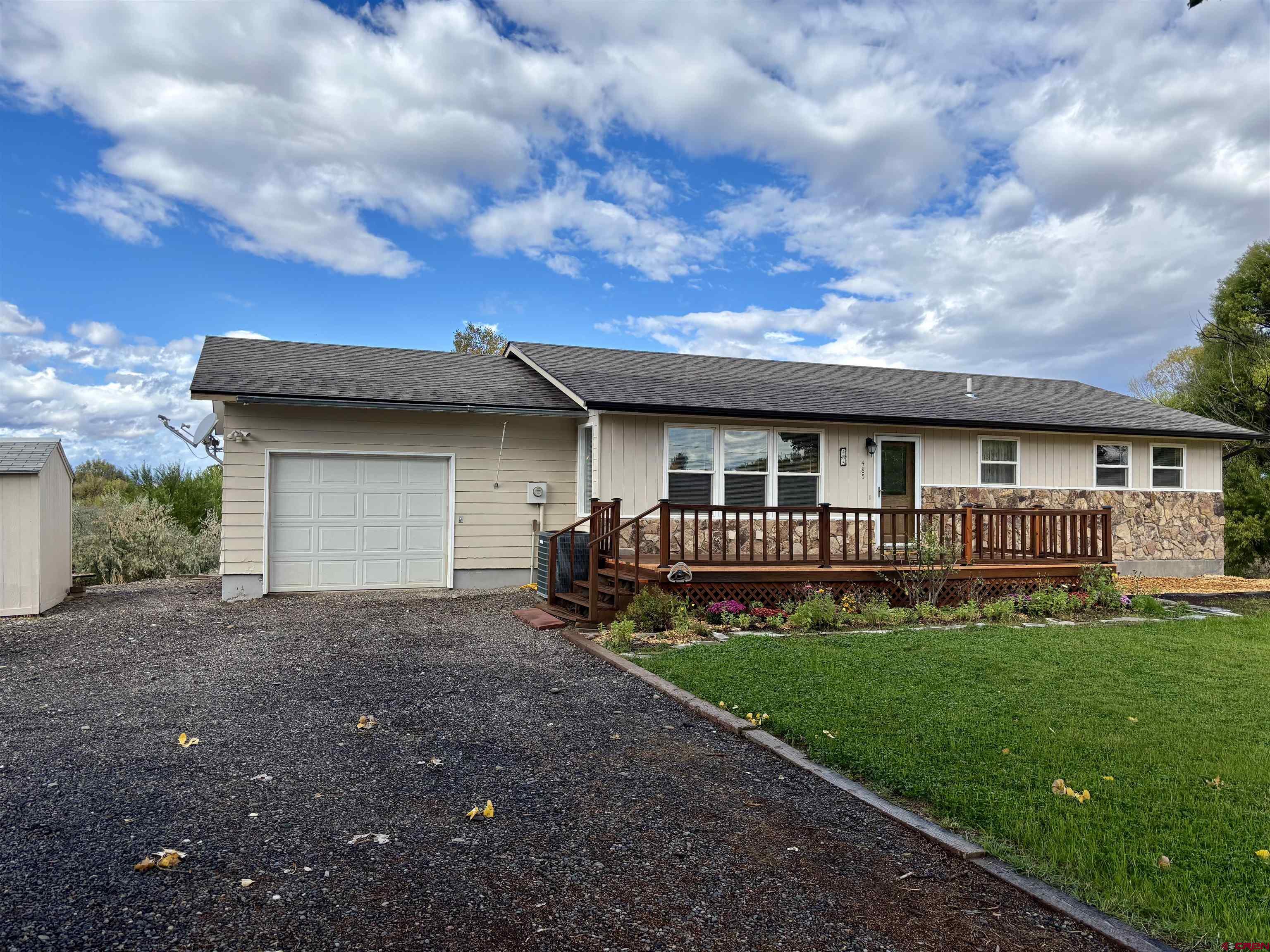 485 1740th Road Delta, CO 81416 - Photo 34 of 37 a view of a house with a yard and sitting area