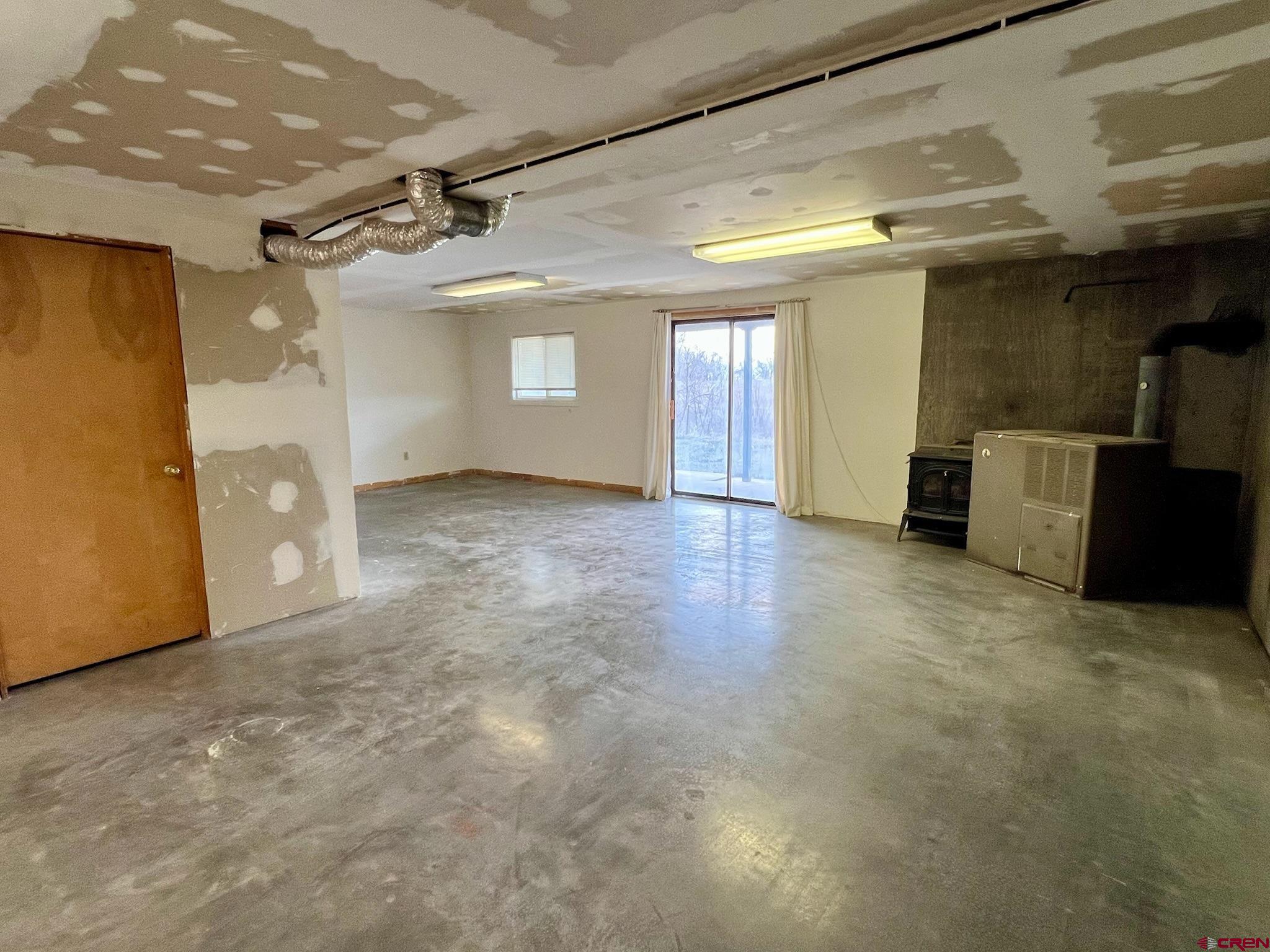 485 1740th Road Delta, CO 81416 - Photo 35 of 37 a view of a livingroom with a dishwasher and a refrigerator
