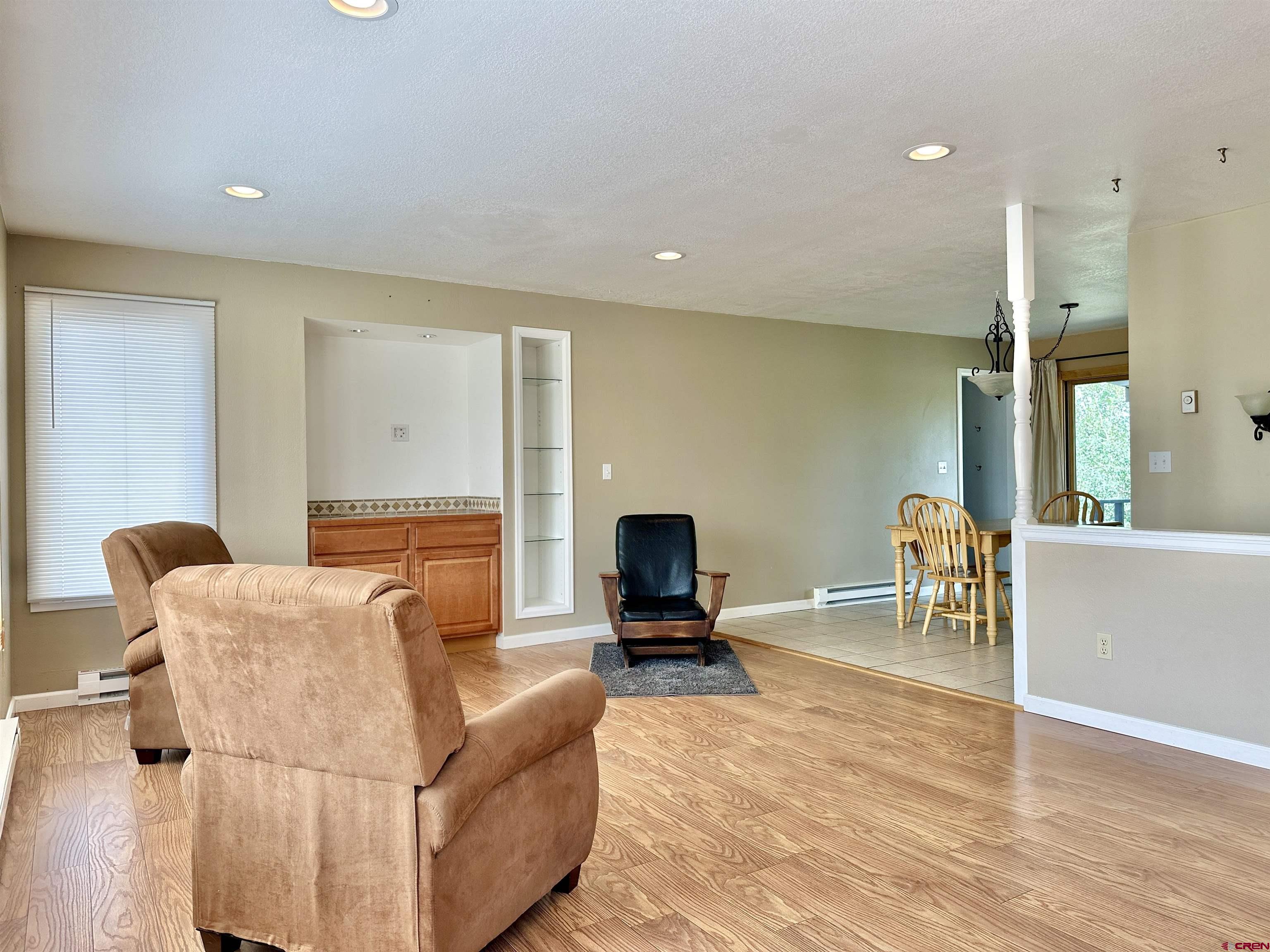 485 1740th Road Delta, CO 81416 - Photo 7 of 37 a living room with furniture and a flat screen tv