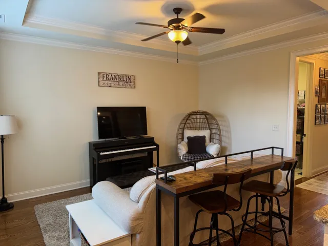 a view of a dining room with furniture and wooden floor