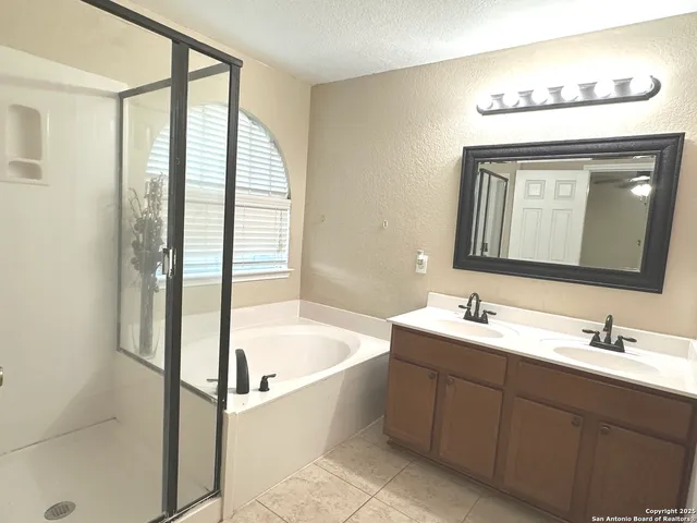 a bathroom with a bathtub and a sink