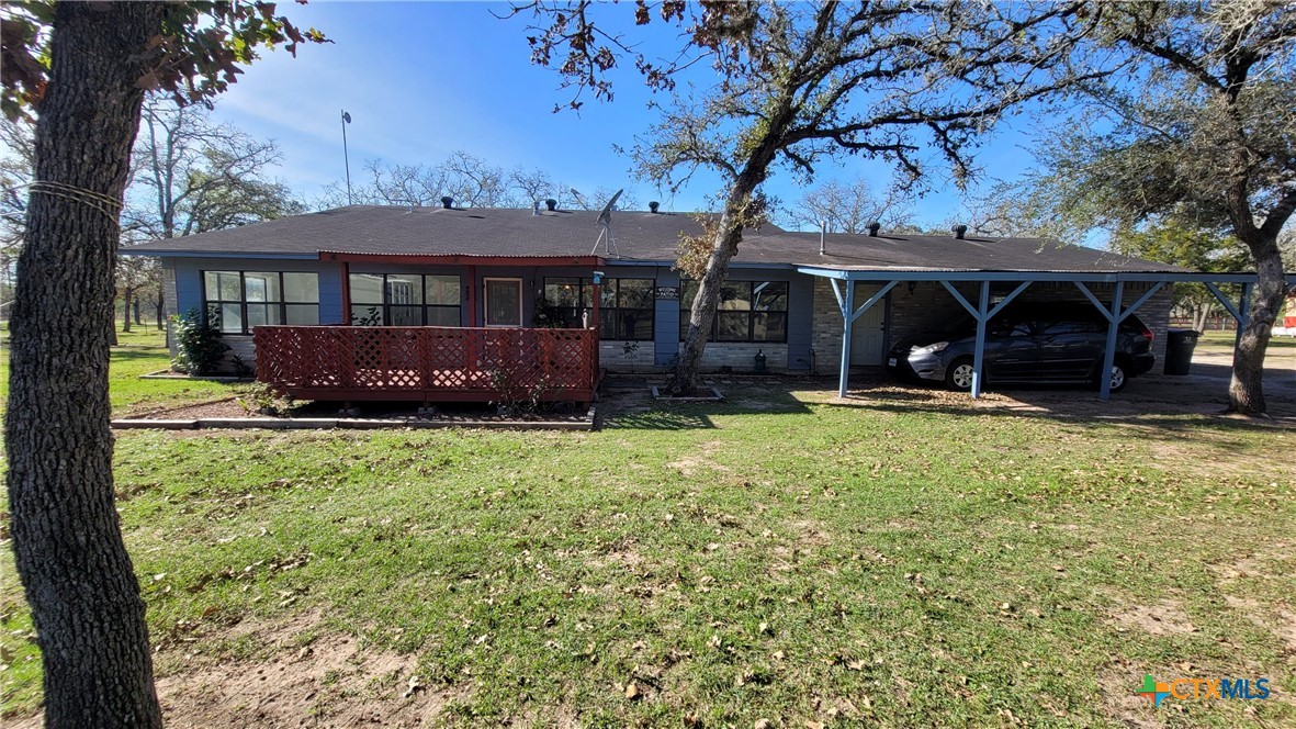127-129 McAdams Road Goliad, TX 77963 - Photo 3 of 33 a view of a house with a yard and tree