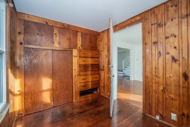 a view of entryway with wooden walls