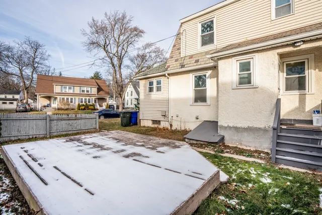 a view of a backyard with large tree