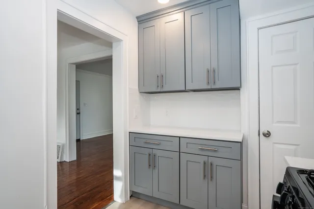 a view of cabinets with wooden floor