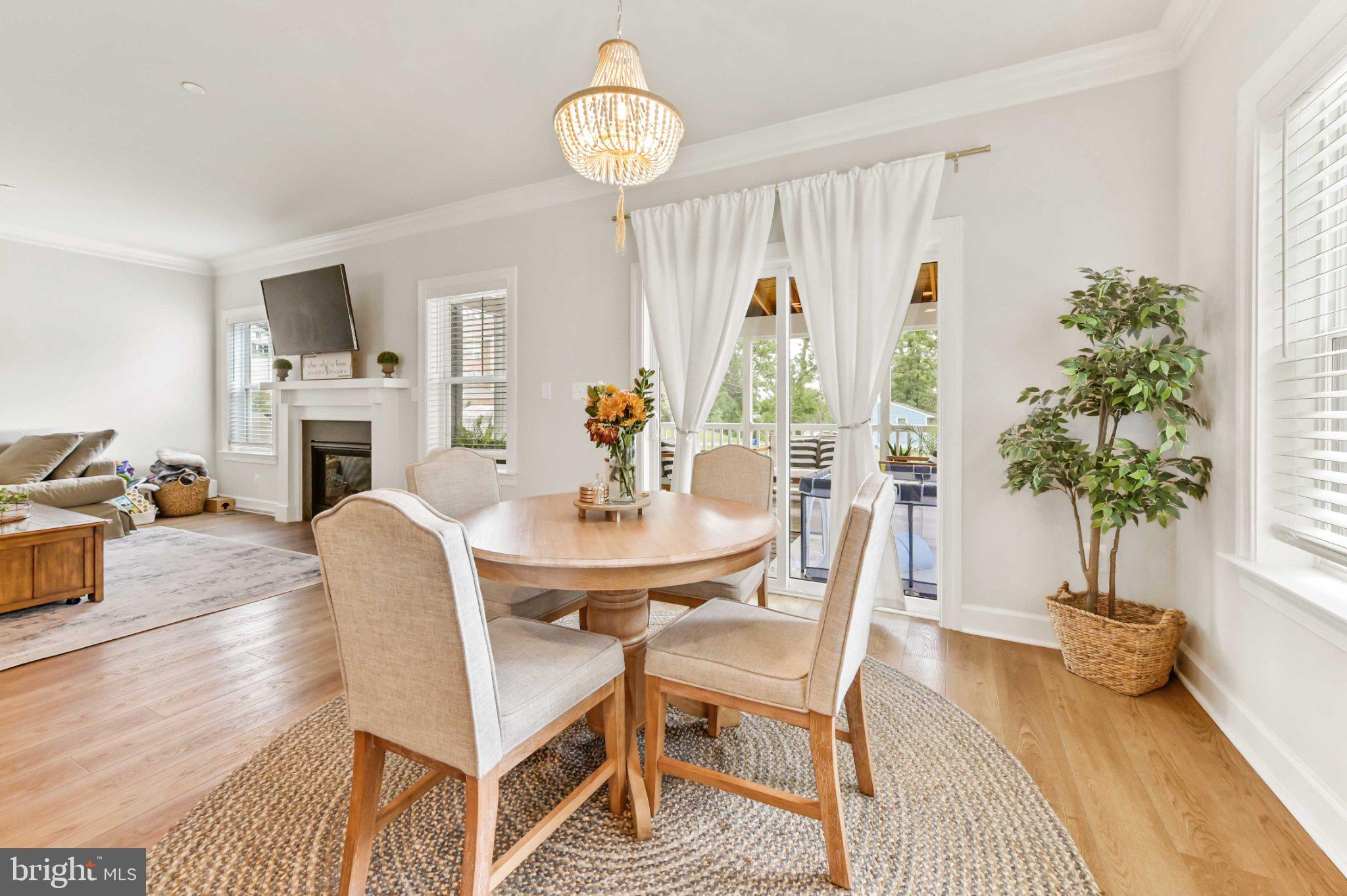 6310 Winters Lane Hanover, MD 21076 - Photo 20 of 76 a view of a dining room with furniture window and wooden floor