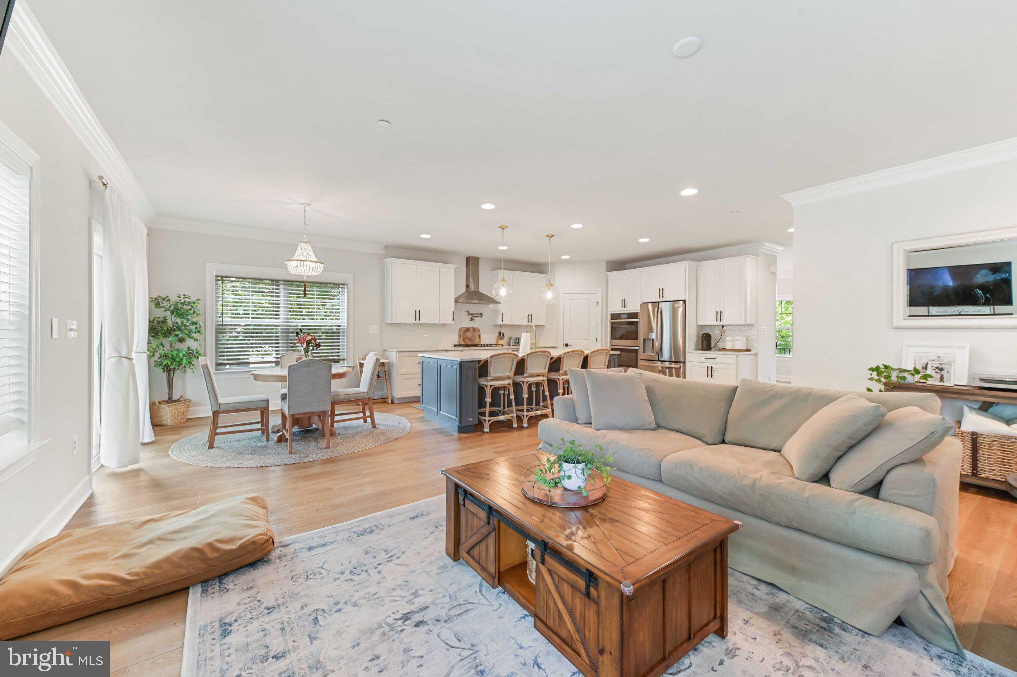 6310 Winters Lane Hanover, MD 21076 - Photo 24 of 76 a living room with furniture kitchen view and a large window