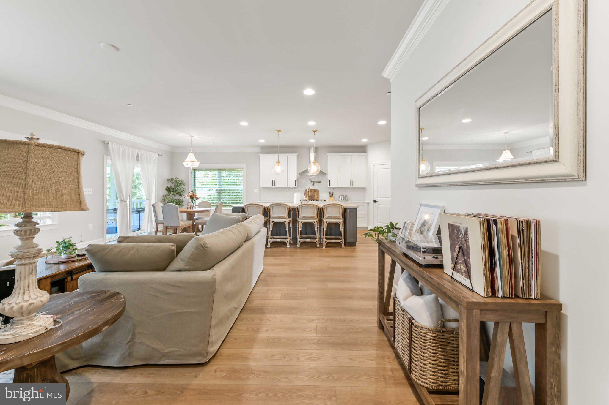 6310 Winters Lane Hanover, MD 21076 - Photo 27 of 76 a living room with furniture and a table