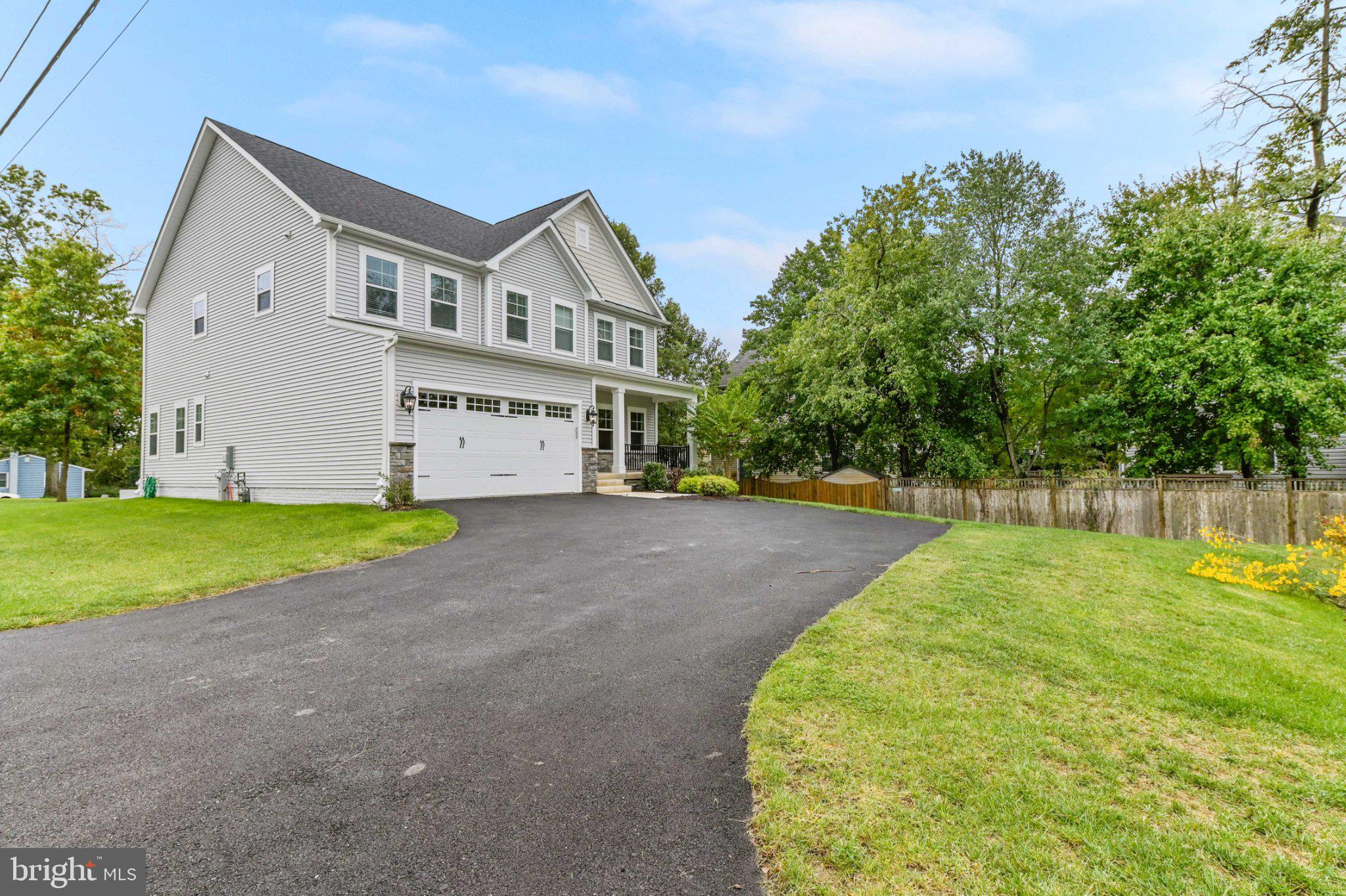6310 Winters Lane Hanover, MD 21076 - Photo 3 of 76 Charming home with lush greenery.