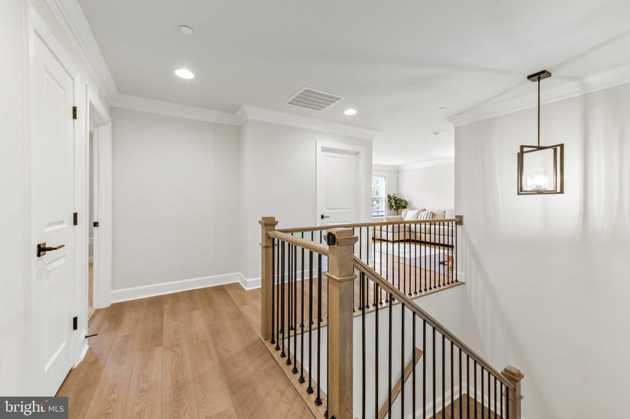 6310 Winters Lane Hanover, MD 21076 - Photo 34 of 76 a view of hallway with wooden floor