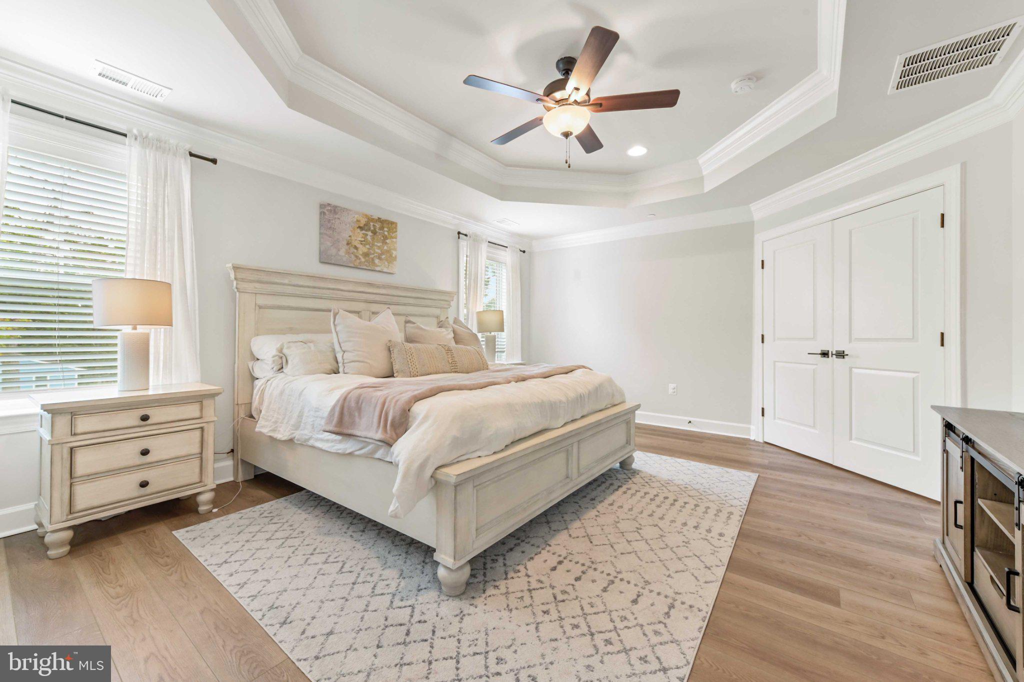 6310 Winters Lane Hanover, MD 21076 - Photo 45 of 76 a bedroom with a bed and a chandelier