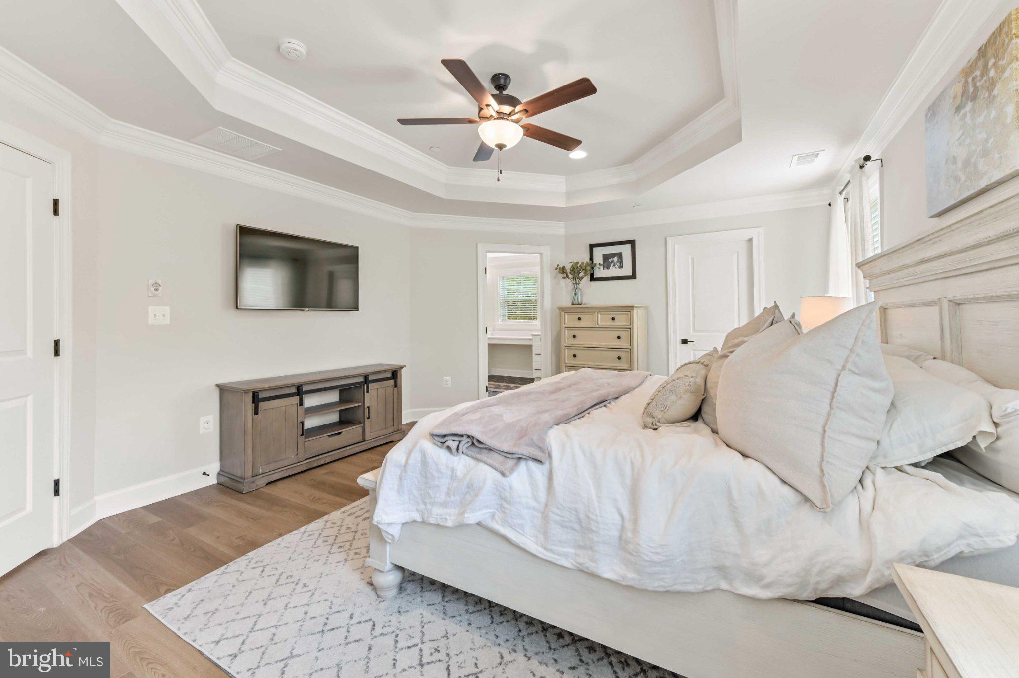 6310 Winters Lane Hanover, MD 21076 - Photo 48 of 76 a bedroom with a large bed dresser and a window