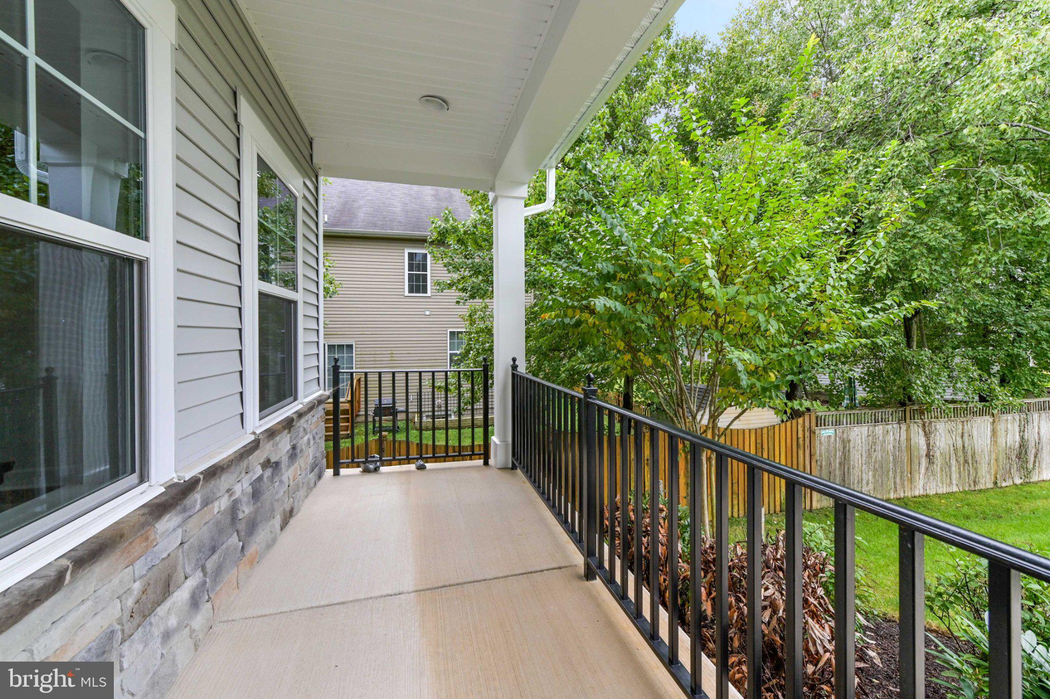 6310 Winters Lane Hanover, MD 21076 - Photo 5 of 76 Serene balcony with lush greenery views.