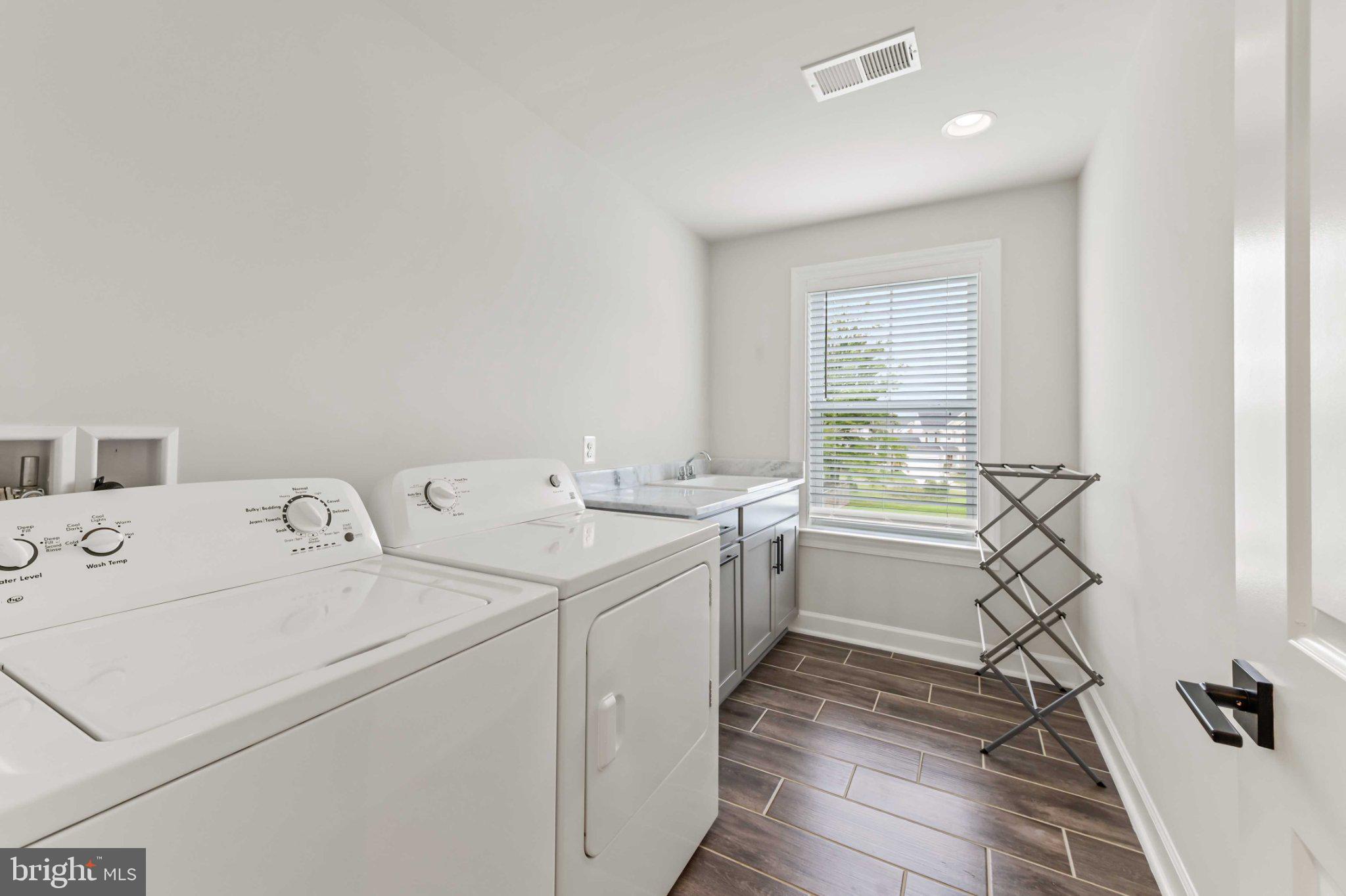 6310 Winters Lane Hanover, MD 21076 - Photo 58 of 76 a utility room with dryer and washer