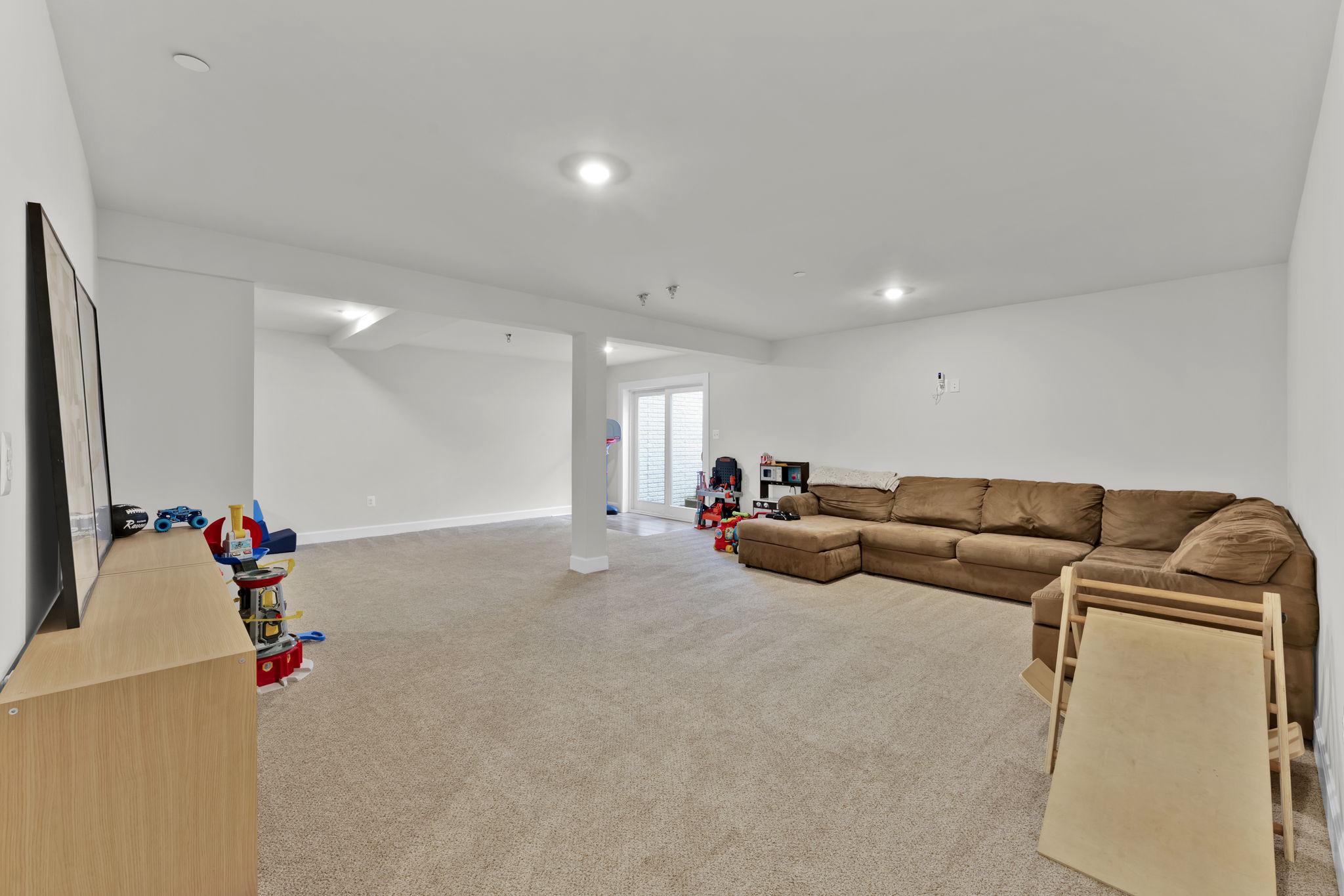 6310 Winters Lane Hanover, MD 21076 - Photo 61 of 76 a living room with furniture and a couch