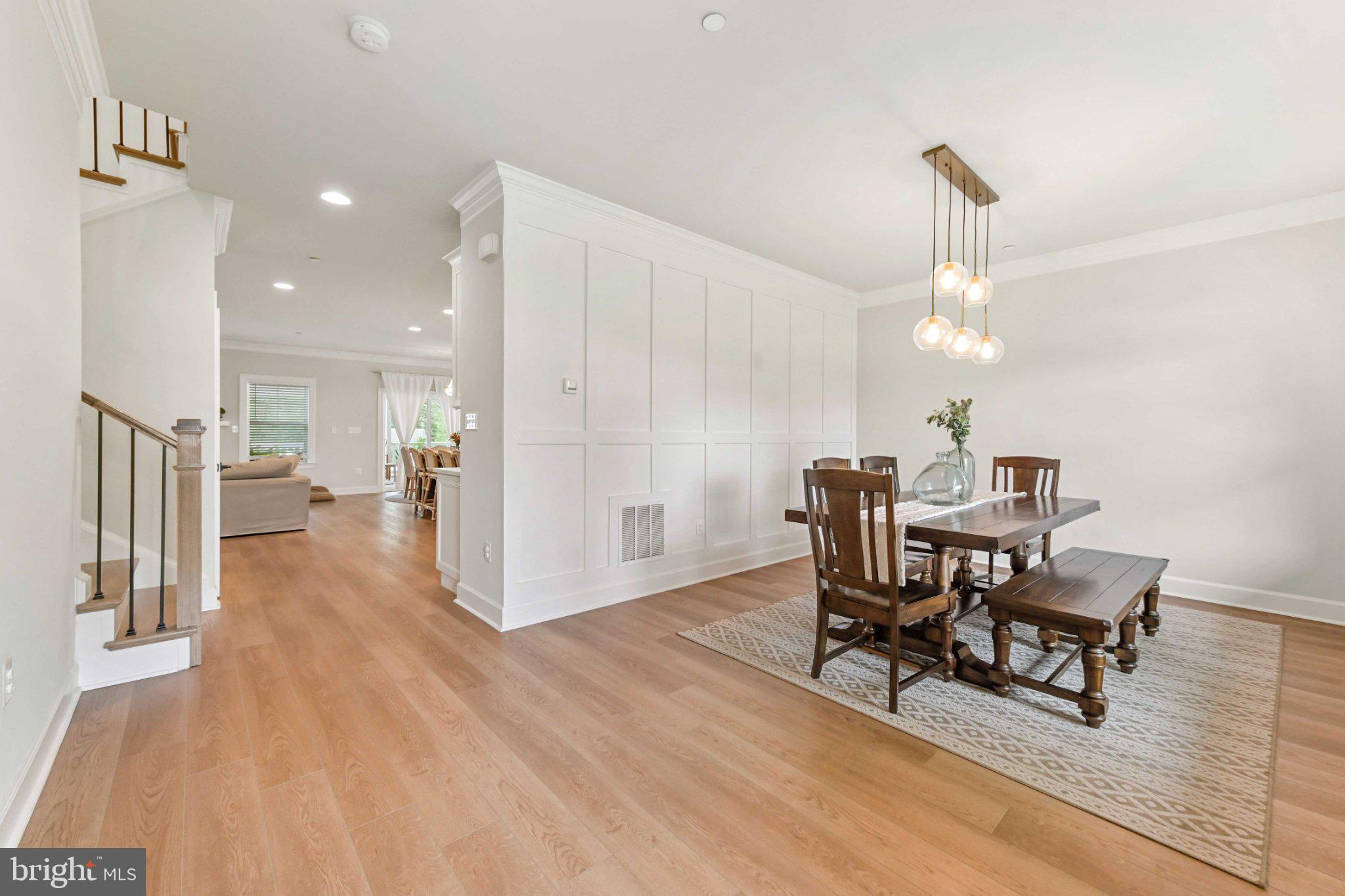 6310 Winters Lane Hanover, MD 21076 - Photo 7 of 76 a view of a dining room with furniture and wooden floor
